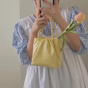 Yellow ruched mini handbag detail shot, cute casual style, perfect for daily wear.