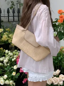 French vintage straw woven shoulder bag detail view, casual summer underarm tote design.