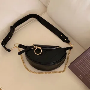 Black chic crescent waist bag for women, stylish chest bag with wide strap and gold chain.