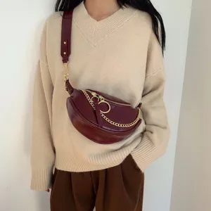Women stylish crescent crossbody bag with metal ring chain strap detail for autumn fashion