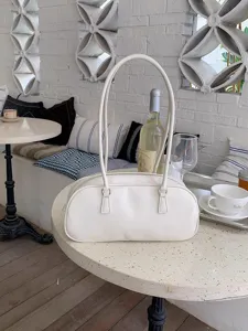 Stylish white minimalist shoulder bag for women, elegant long strap handbag for daily wear.