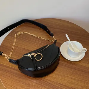 Fashion black leather crescent waist bag with gold chain strap, trendy crossbody chest bag.