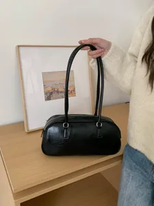 Minimalist black shoulder bag, chic barrel handbag for women, casual daily tote purse.