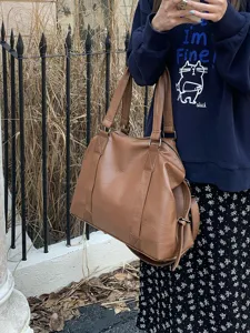 Brown PU leather travel tote bag, large capacity shoulder handbag for women daily commute.