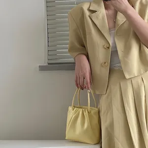 Light yellow square pleated handbag, stylish PU leather shoulder bag for women daily casual wear.