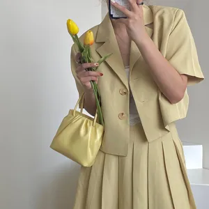 Light yellow square pleated handbag for women, stylish summer shoulder crossbody bag.