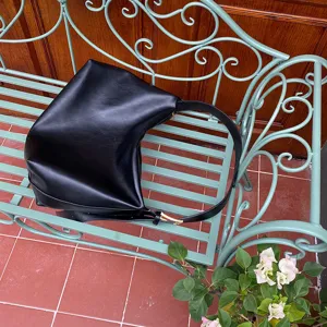 Minimalist black shoulder bag for women, soft slouchy tote handbag for daily use and work.