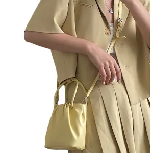 Light yellow square pleated crossbody bag for women, stylish summer shoulder handbag chic.
