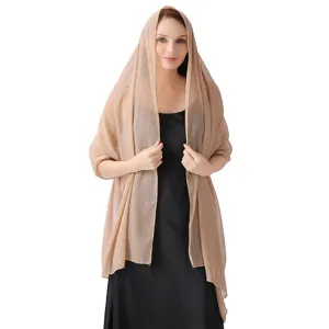Detailed view of women elegant shimmering chiffon shawl with silver threads and rhinestones.