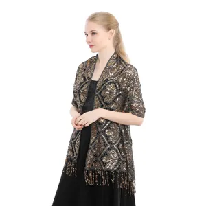 Elegant sequin tassel shawl detail showing sparkly mesh fabric for evening dresses.