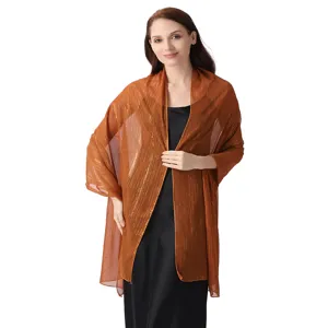 Shimmery chiffon evening shawl detail, elegant copper wrap with delicate silver threads.