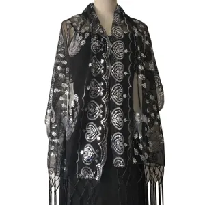 Black sequin embroidered mesh shawl detail, elegant evening dress accessory wrap.