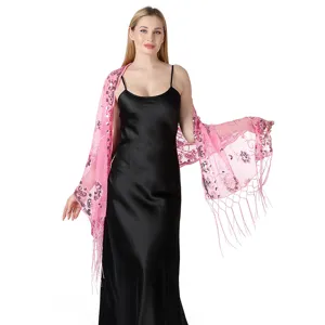Close-up view of the exquisite pink sequin embroidery and delicate tassel hem details.