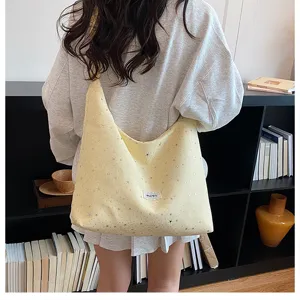 Casual yellow star print canvas tote bag for women, large capacity slouchy shoulder bag.