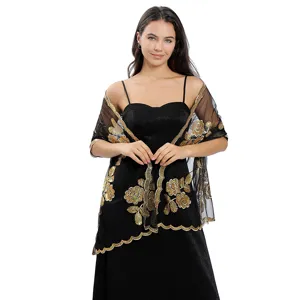 Châle noir en tulle transparent avec broderie de pivoines dorées et bord festonné élégant.