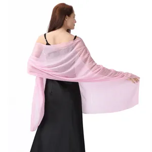 Close-up of pink chiffon evening shawl featuring shimmering silver threads and delicate rhinestones.