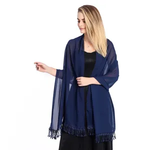 Close-up detail of the elegant dark blue chiffon shawl featuring delicate bottom lace and tassels.
