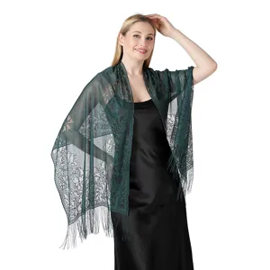 Detail view of elegant dark green floral lace shawl and fringe scarf for evening dress and party.
