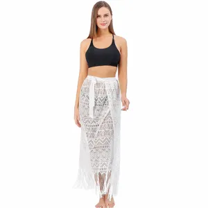 White lace beach cover up skirt detail, hollow out mesh design, fringe hemline, summer resort wear.