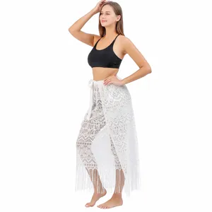 White lace beach cover up skirt detail, hollow out design, fringe hem, lightweight fabric.