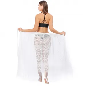 White lace beach cover-up skirt with geometric pattern and fringe details for summer holidays.