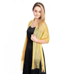 Gold metallic shimmer evening shawl, elegant party wrap detail view for women apparel.