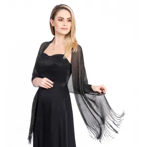 Black metallic evening shawl detail showing shimmering fabric texture and delicate fringe trim.