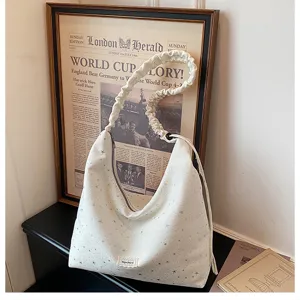 White tote bag detail, star print, slouchy hobo style, scrunchie strap, casual daily handbag.