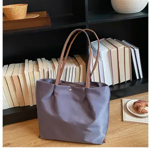 Casual oxford cloth shoulder tote bag in gray purple with brown straps, detailed view.