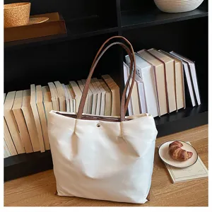 Casual oxford cloth shoulder bag for women, large capacity stylish tote bag for daily commute.