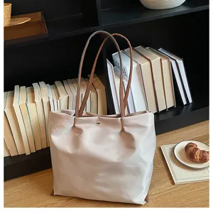 Stylish casual oxford cloth tote bag for women, large capacity shoulder bag for daily commuting use.