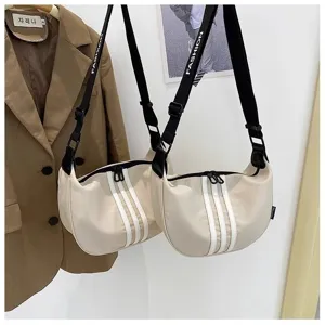 Casual nylon dumpling crossbody bag for women, stylish crescent shoulder bag with strap.