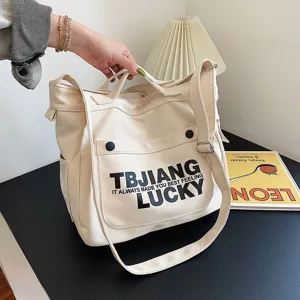 Large capacity beige canvas tote bag, casual shoulder crossbody bag for daily commute.
