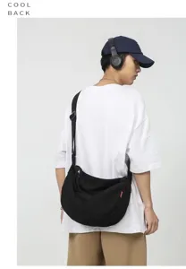 Casual black canvas shoulder bag for women and men, versatile daily crossbody messenger bag.