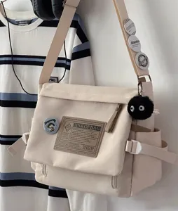 Casual large capacity canvas messenger bag, Japanese retro style commuter crossbody bag for students.