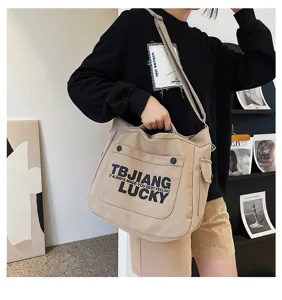 Large capacity canvas tote bag for women, stylish shoulder and crossbody letter print handbag.