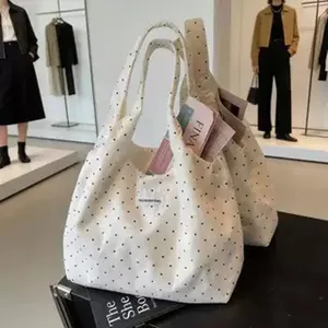 Canvas polka dot shoulder bag, large capacity stylish tote bag for women daily casual use.