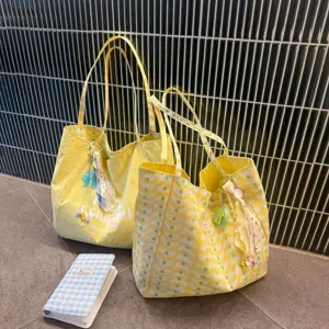 Large capacity double sided canvas tote bag casual versatile shoulder commuter bag.