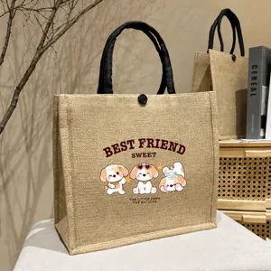 Detailed view of large capacity burlap tote bag with cute dog print and durable handles.