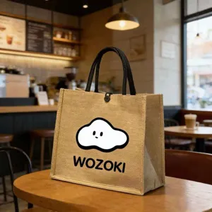 Detail view of jute tote bag with cute cloud print in cozy cafe setting, large capacity.
