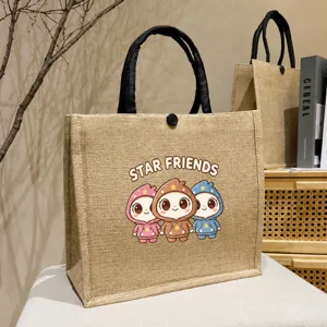 Jute tote bag with cute cartoon print and black handles, spacious daily shoulder bag for commute.