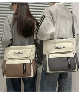 Large capacity canvas shoulder bag detail, stylish two-tone design, durable everyday crossbody.