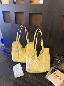 Large capacity yellow canvas tote bag for casual commuting and daily shopping use.