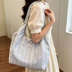 Light blue polka dot canvas tote bag for women, large capacity casual shoulder bag daily use.
