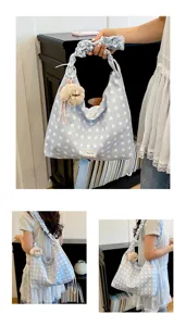 Detailed view of the Korean style casual polka dot canvas tote bag with shoulder strap.