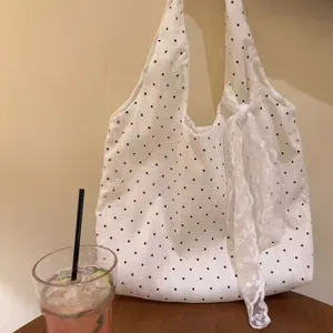 White polka dot canvas shoulder bag for women, large capacity stylish tote bag for summer.