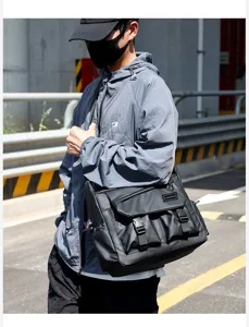 Trendy large capacity waterproof black messenger bag, versatile crossbody bag for men.