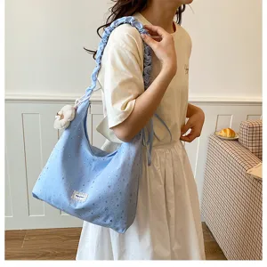 Blue star print slouchy tote bag with ruffled strap and cute flower pendant for daily fashion.