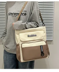 Casual canvas shoulder bag for women, large capacity stylish messenger bag with contrast design.