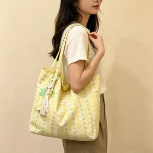 Large capacity canvas tote bag for women, casual single shoulder commuting handbag.